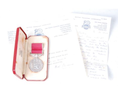 An E.R. II British Empire medal, naming Ernest William Porter, in original Royal Mint red leather case of issue, together wit