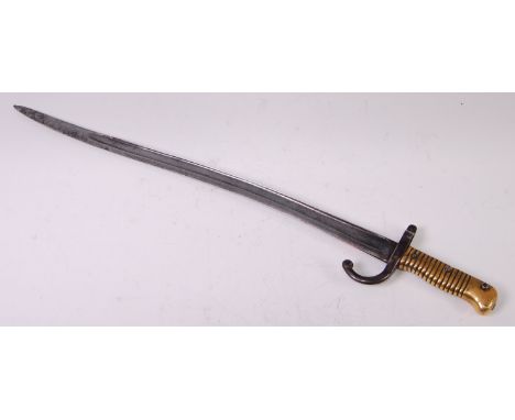 A French model 1866 chassepot bayonet, having a 57cm fullered yataghan shaped steel blade with hooked quillon stamped 10639 a