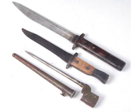 A British No. 4 Mk II spike bayonet and scabbard, together with two other Ross type bayonets. (3)