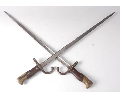 A French model 1874 Gras bayonet, the 52cm single edged blade inscribed to the back edge Mre d'armes de St Ettienne Obre 1878