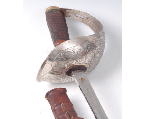 A British 1912 pattern Officer's Cavalry sword, the 89cm single edged blade etched with a GR cypher amongst foiliage, marked 