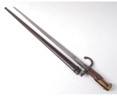 A French Model 1874 Gras bayonet, the 52.5 cm single edged blade with inspection stamps to the ricasso and inscribed to the b