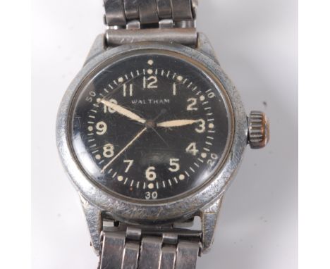A gentleman's Waltham military steel cased wristwatch, circa 1945, having a signed black dial with luminous Arabic numerals a