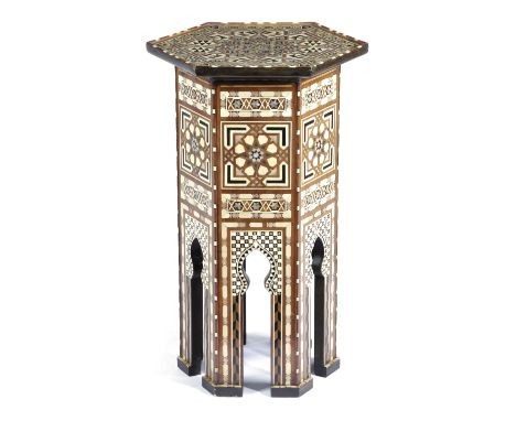 λ A MOORISH WALNUT HEXAGONAL OCCASIONAL TABLE FIRST HALF 20TH CENTURY inlaid with bone, mother of pearl, tortoiseshell and eb