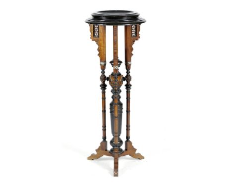 A MOORISH WALNUT AND EBONISED TORCHERE PROBABLY SYRIAN, LATE 19TH / EARLY 20TH CENTURY inlaid with mother of pearl, the dishe