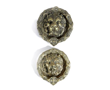 TWO LARGE BRASS DOOR KNOCKERS LATE 19TH / 20TH CENTURY each modelled with a lion's mask and a ribbon and rosette knocker (2) 