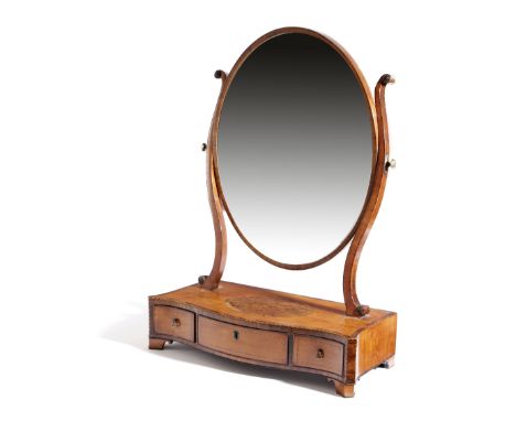 λ A GEORGE III SATINWOOD DRESSING TABLE MIRROR C.1790-1800 the later oval plate with scroll supports above a serpentine box b