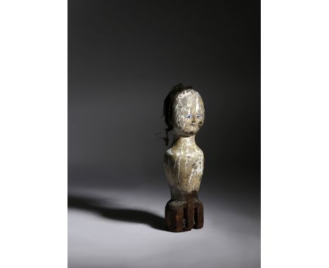 A FOLK ART CARVED WOOD AND DECORATED PRIMITIVE BEDPOST DOLL POSSIBLY AMERICAN, LATE 19TH CENTURY with enamel eyes and remains