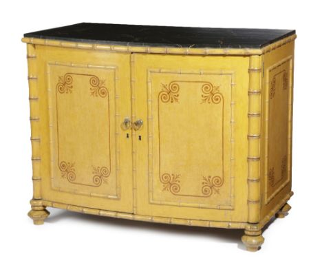A PAIR OF REGENCY PAINTED PINE FAUX BAMBOO BOWFRONT COMMODES EARLY 19TH CENTURY each with an ebonised simulated marble top, a