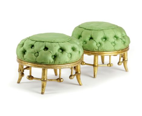 A PAIR OF GILTWOOD FAUX BAMBOO STOOLS 19TH CENTURY each with a button upholstered green silk seat, on stretchered supports (2