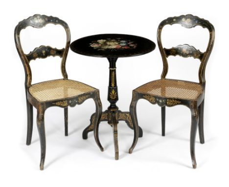 AN EBONISED AND PARCEL GILT OCCASIONAL TABLE SECOND HALF 19TH CENTURY the circular tilt-top painted with flowers, on tripod s