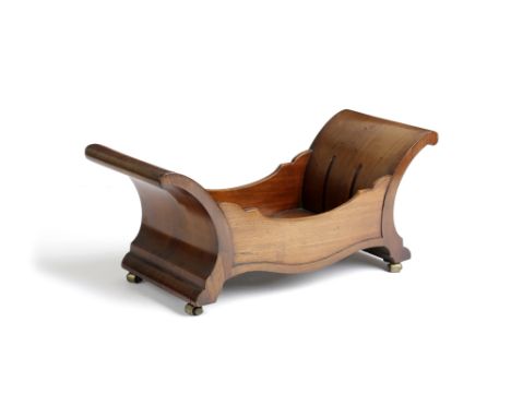 A REGENCY MAHOGANY CHEESE COASTER EARLY 19TH CENTURY of scroll form, with panelled sides and originally with two divisions, o