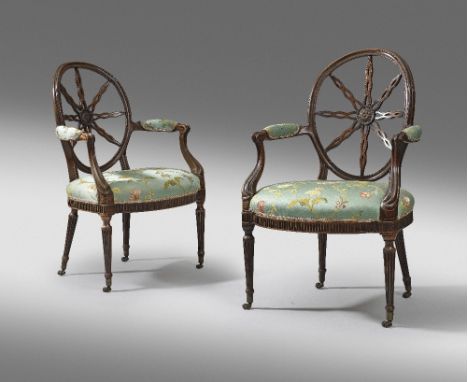 A PAIR OF GEORGE III MAHOGANY OPEN ARMCHAIRS; IN THE MANNER OF THOMAS CHIPPENDALE, C.1775 each with an oval back, with eight 