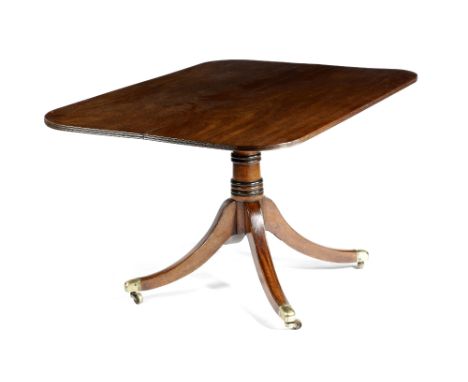 A GEORGE IV MAHOGANY BREAKFAST TABLE C.1825 the rectangular tilt-top with rounded corners and a reeded edge, on a turned stem