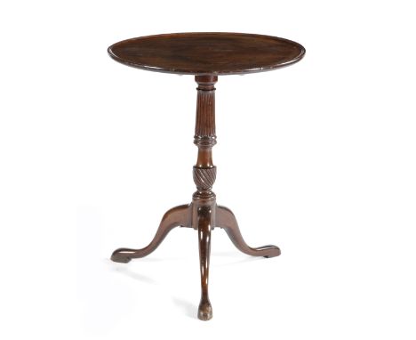 A GEORGE II MAHOGANY TRIPOD OCCASIONAL TABLE MID-18TH CENTURY the circular dished tilt-top above a fluted stem and a conformi