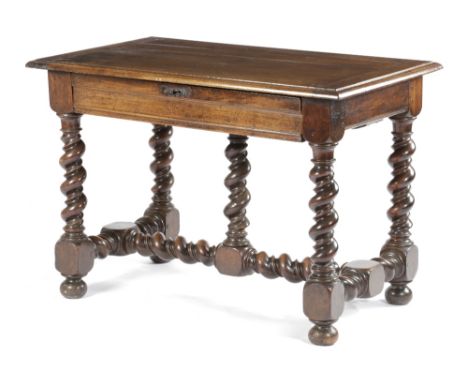 A BAROQUE WALNUT SIDE TABLE FRENCH OR ITALIAN, 17TH CENTURY the boarded top, with cleated ends and a moulded edge, above a fr