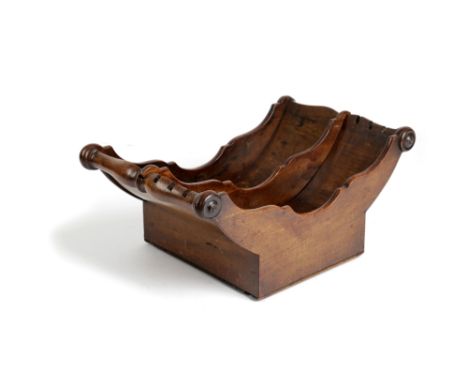 A REGENCY MAHOGANY CHEESE COASTER EARLY 19TH CENTURY with split baluster lifts and applied rondels, with an adjustable divisi