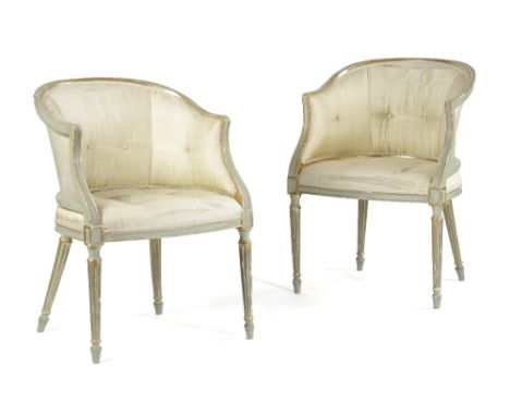 A PAIR OF PAINTED AND PARCEL GILT TUB CHAIRS IN GEORGE III STYLE each button upholstered with cream silk, with moulded frames