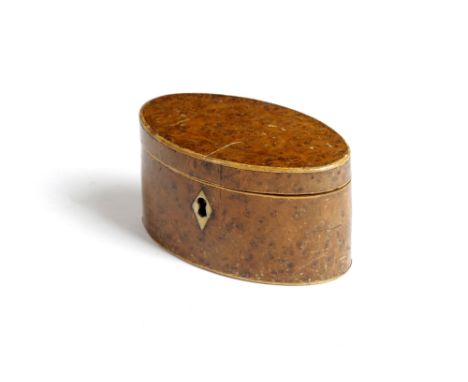 A SMALL GEORGE III OVAL BURR YEW TEA CADDY C.1800 with boxwood edging and a bone escutcheon, the interior with traces of foil