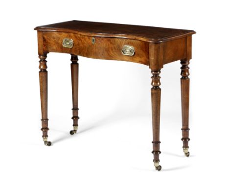 A GEORGE IV MAHOGANY SERPENTINE SIDE TABLE C.1820 the moulded edge top above a frieze drawer, on vase turned legs and brass c