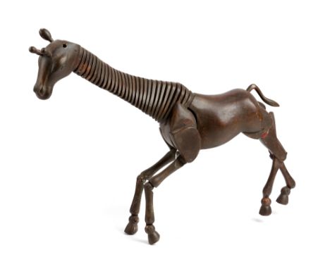 A STAINED WOOD ARTIST'S GIRAFFE LAY MODEL FIRST HALF 20TH CENTURY with articulated head, neck and limbs 45.3cm high, 53cm lon