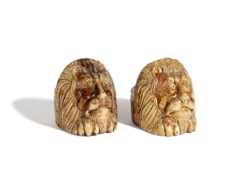 A NEAR PAIR OF BROWN STONEWARE POTTERY SASH WINDOW / FURNITURE RESTS 19TH CENTURY in the form of lion's heads (2) 13cm high, 