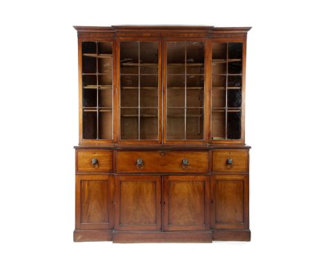 A REGENCY MAHOGANY BREAKFRONT SECRETAIRE LIBRARY BOOKCASE EARLY 19TH CENTURY with reeded decoration, the moulded detachable c