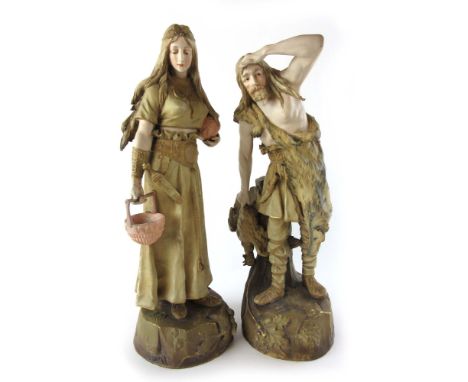 A pair of Austrian Ernst Wahlis Turn Wien ceramic figures modeled as a hunter and a water carrier both marked underneath 13T1