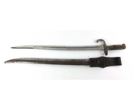 A 19th century Chassepot bayonet with original scabbard and leather strap, blade bearing several stamp makers marks, blade le