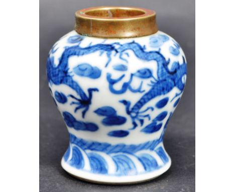 A 19th Century Chinese blue and white miniature vase having a brass rim with dragons chasing the flaming pearl to the body. F