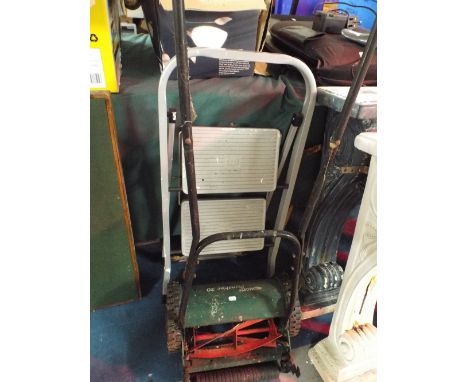 A Qualcast Panther 30 Push Mower Together with A Small Step Ladder.