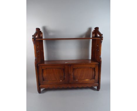 An Edwardian Walnut Wall Hanging Shelf with Base Cupboard.