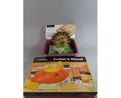 A National Geographic Potters Wheel, Pin Ball Plinko Game and Other Toys.