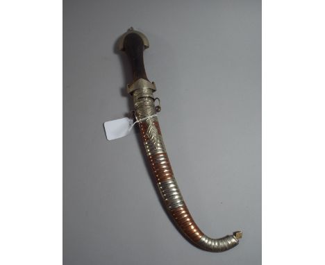 A Persian Curved Blade Dagger with Mixed Metal Scabbard and Wooden Handle.