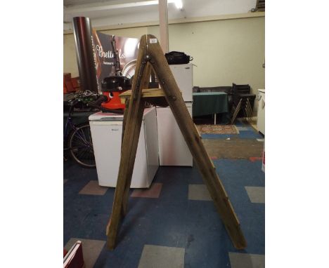 A Wooden Step Ladder.