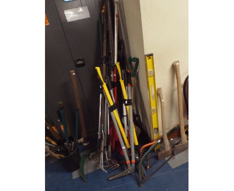 A Large Collection of Garden Tools to Include Lawn Edgers, Forks, Shovels, Bushman Saws, Pick Axe, Axes, Hand Axes Etc. 