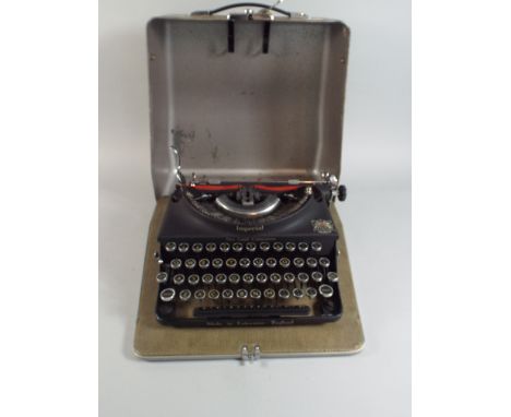 A Metal Cased Imperial Good Companion Vintage Typewriter. 