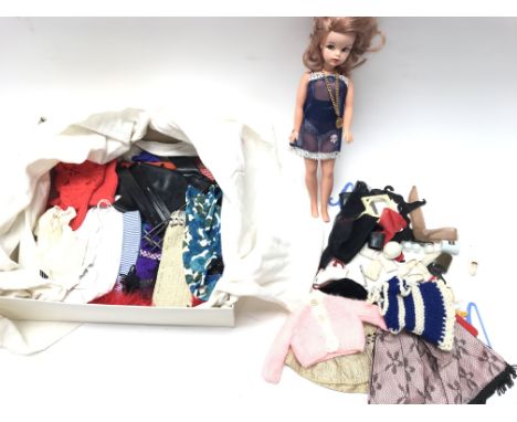 A Vintage Sindy Doll with Numerous outfits and accessories.