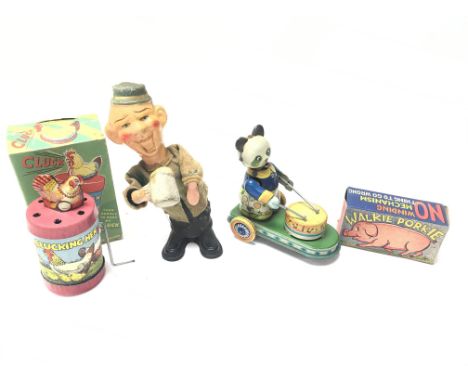 A Vintage Figure Push up Figure of a Drinker, Drumming Panda on Wheels, Clucking Hen in Box and a pull along Pig.
