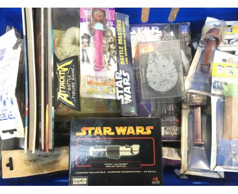 Star Wars box containing boxed Battle Master figure, pen containers mini light sabre, Star fleet models etc.