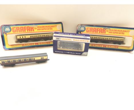 A Dapol 'N' Gauge BR unlined black early crest, boxed. 2 carded coaches and 1 loose.