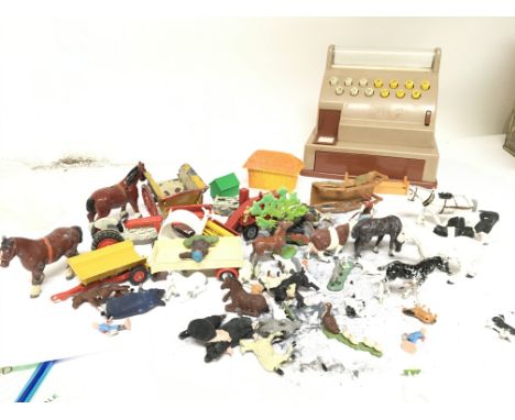 Two tins containing vintage play worn farm animals plastic and painted metal and a toy shop till. (a lot)