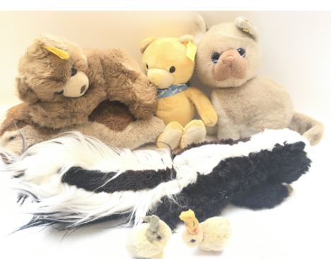Steiff animals, four medium size including Get well bear, a cat, a dog, and a bear, also 2 small rabbits plus a plush skunk.