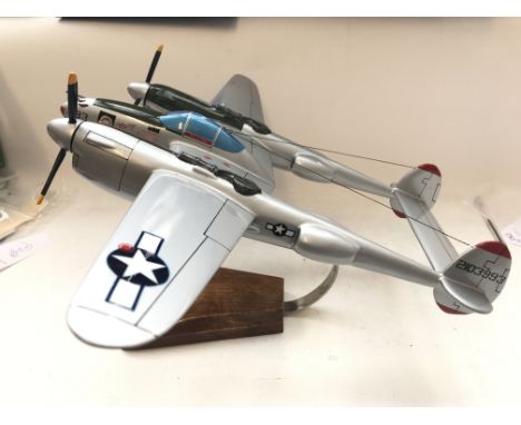 A Resin model of a Lockheed P-38 Lighting on stand.wing span approx 39cm.