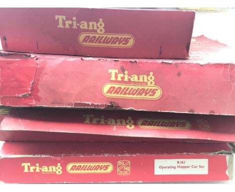 A Tri-ang 00 gauge Train set, a Passenger Train and a operating Hopper car set and a Operating T.C. Mail Coach set.all boxed.
