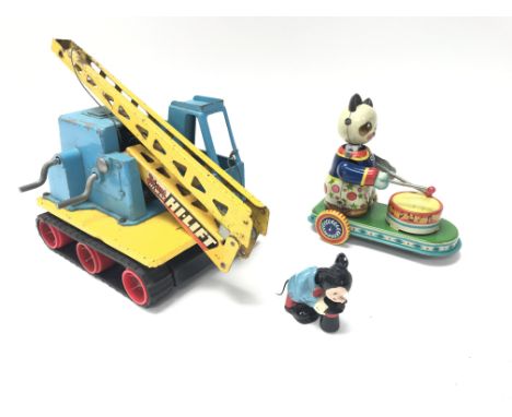 A Tri-ang Hi-way Hi-Lift. A vintage tin plate clockwork cat and a vintage dding Mickey Mouse.
