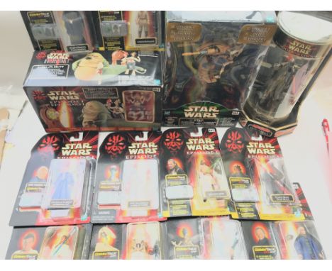 A Large collection of Star Wars Episode 1 Carded Figures, light sabres ect.