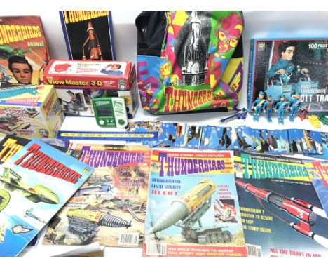 A large collection of Thunder birds memorabilia including Matchbox figures, comics, collectors cards, Veiw master, L.c.d game