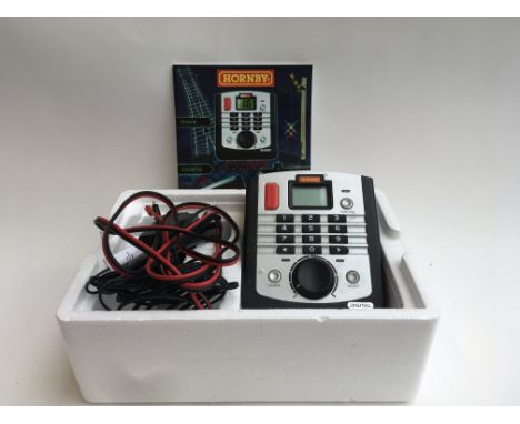 A Hornby 'SELECT' digital controller boxed. With tools and 2 Hornby plean colliery coke wagons.