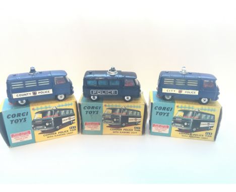Three boxed Commer Police vans with flashing light #464.